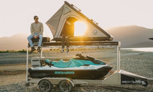 Boat trailer with roof top outlet tent